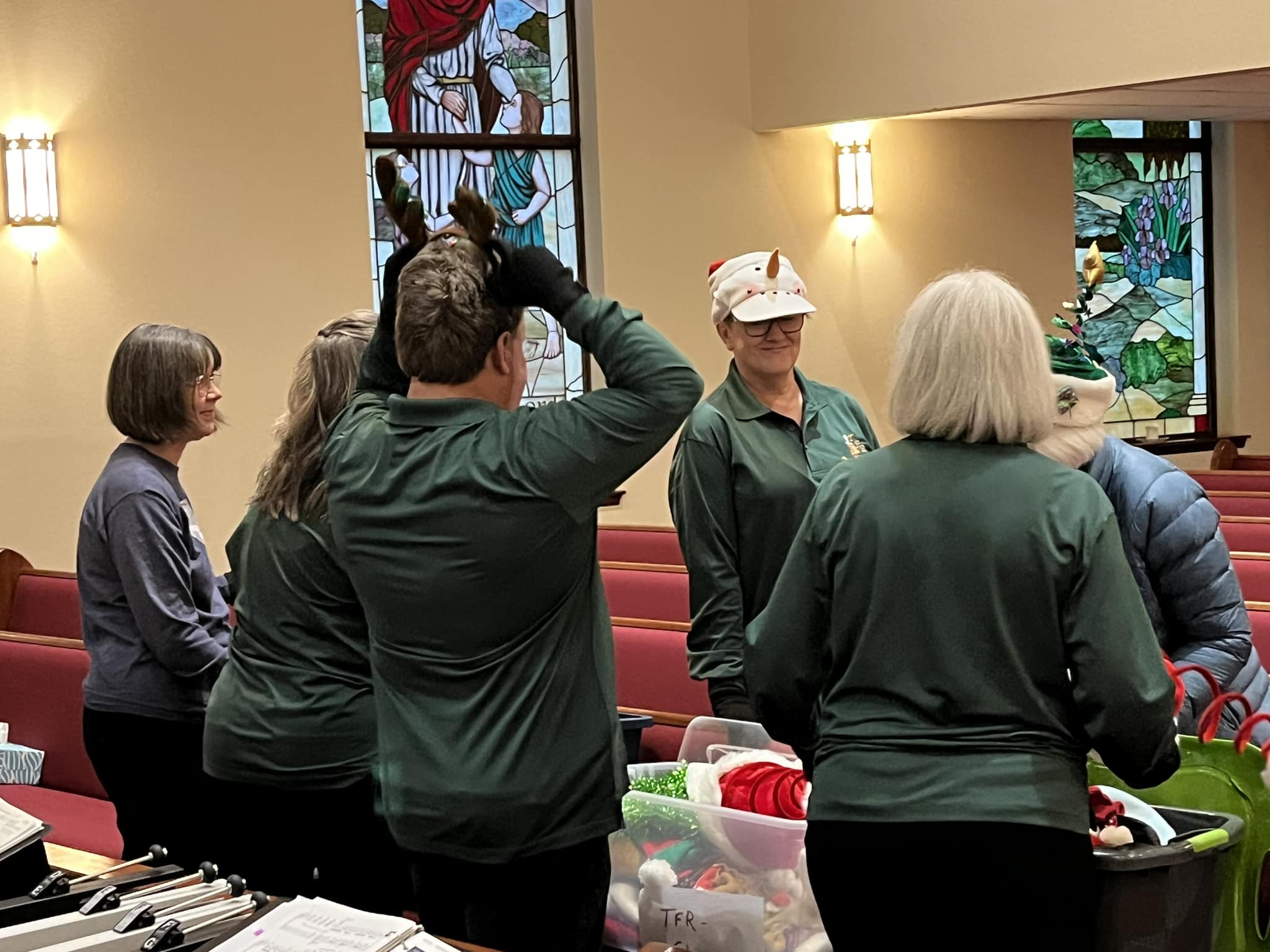 Ringers in Christmas hats at a holiday concert
